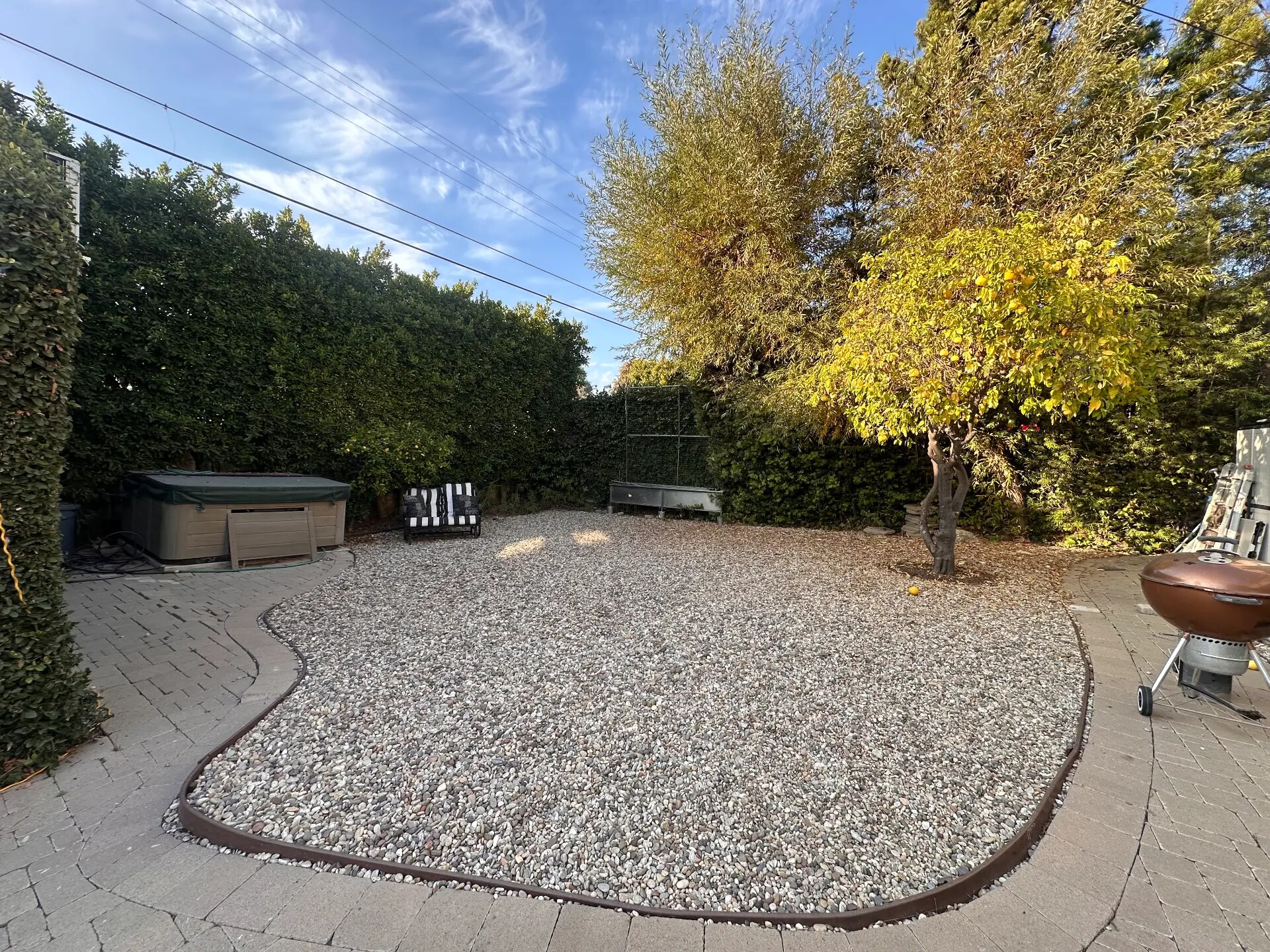 Gravel yard before the Mediterranean drought-tolerant redesign, view 1